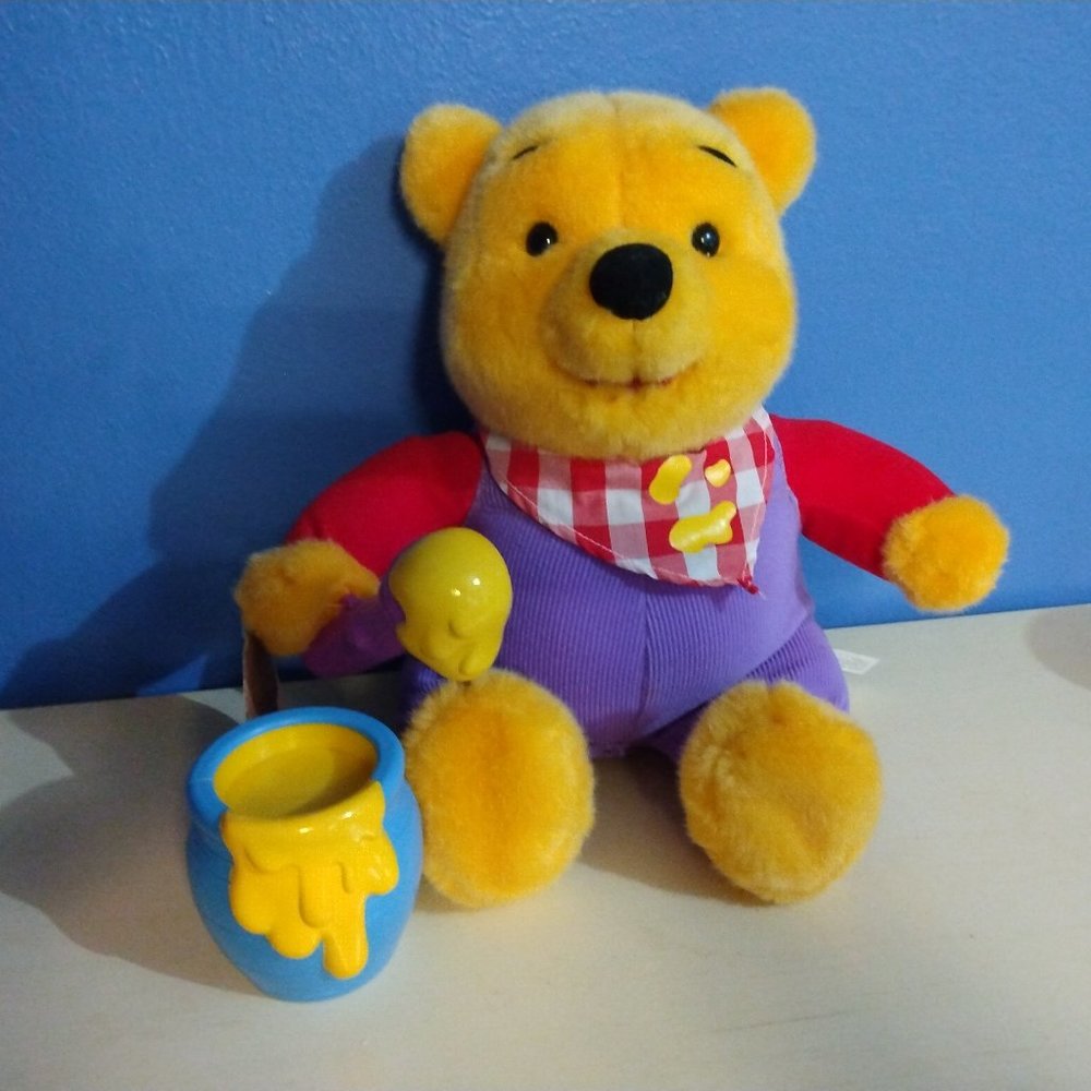 Winnie the Pooh bear collectible toy with honey pot